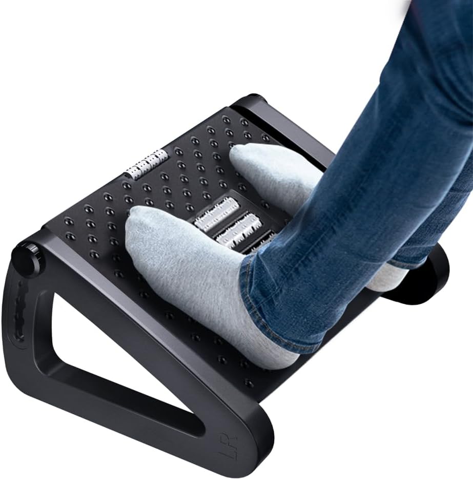 Black six height adjustable footstool with massage rollers under an office desk